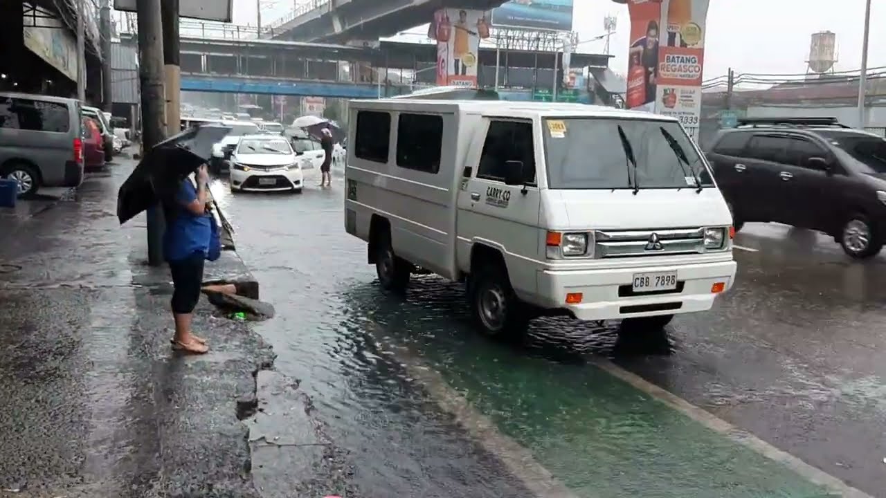 Strong rains beside LRT-1 Balintawak Station in Quezon City.