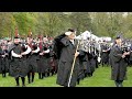 Massed Bands salute Chieftain playing Highland Laddie during 2023 Banchory Pipe Band Championship