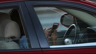 Cameras to catch drivers using mobiles in Qld