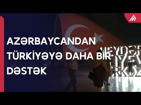 Al-qırmızı bayraq Heydər Əliyev Mərkəzinin binası üzərində əks olunub