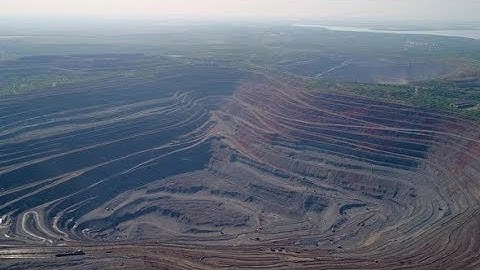 Aerial View of Opencast Mining Quarry with Lots of Machinery at Work | Stock Footage - Videohive