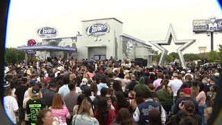 Massive crowd gathers for Dallas Cowboys Post Malone-themed Raising Cane s opening