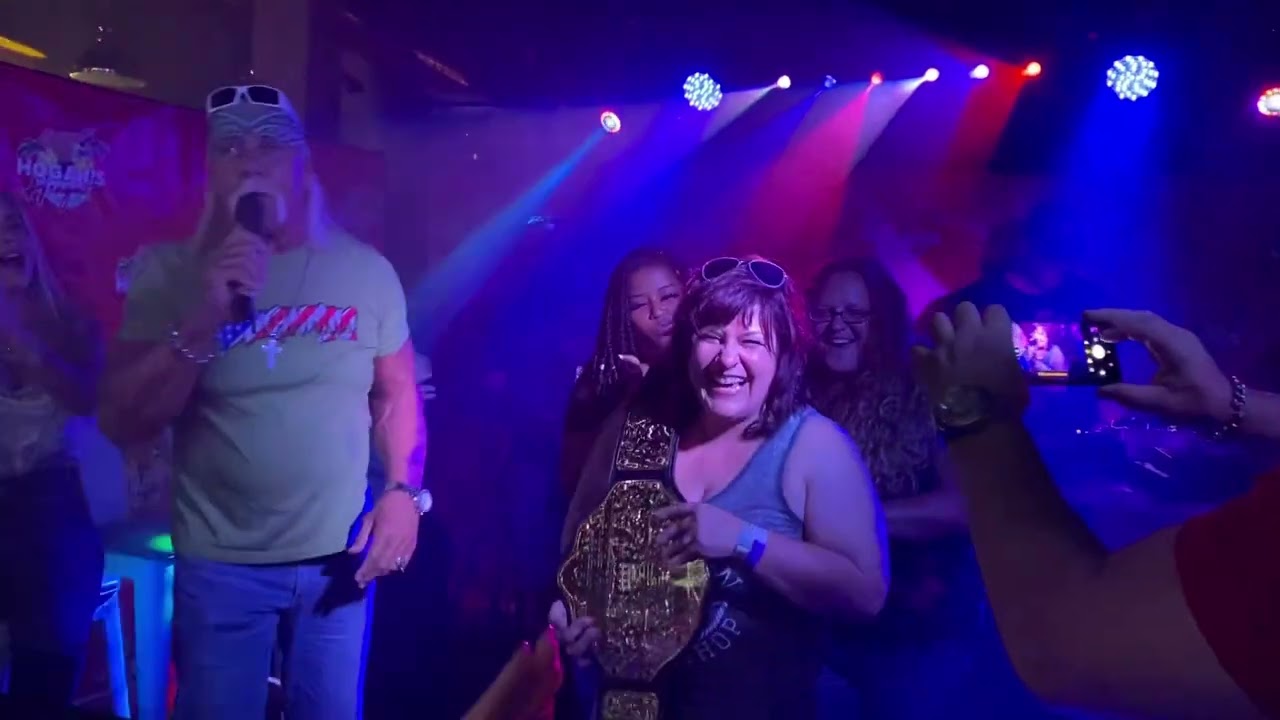 Post Traumatik’s Chelsea wins the championship belt at Hogan’s Hangout in Clearwater Beach, Florida.