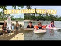 The kids start surfing lessons with Papa!