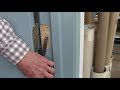 Adjusting a door with two pennies