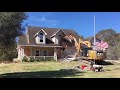 House demolition | excavator demolishing flooded house after hurricane harvey