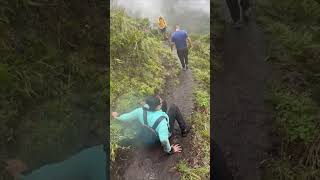 Hiker Slips Down Muddy Trail During Descent