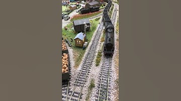 Standard Class 4MT pulling coal across streamlined points.