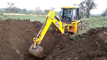 JCB Machine Cutting Mud and Loading in Tractor - JCB Digging For Road Foundation Construction