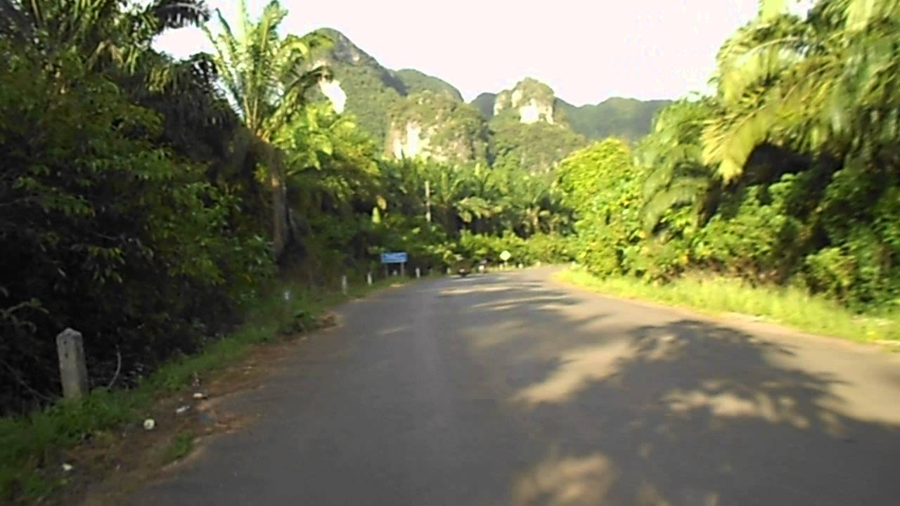 Scooters in Thailand. Exploring the back roads of Krabi, Thailand on a Honda motor scooter.