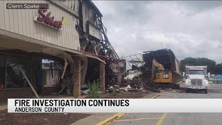 Upstate business owners search for answers as a large fire investigation continues