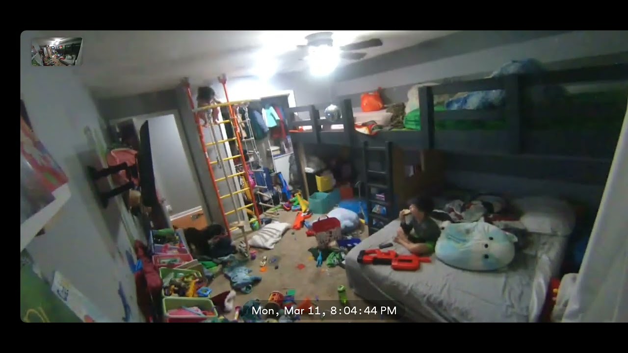 Girl climbs to the top of ladder on home jungle gym and jumps/falls off (Security camera)