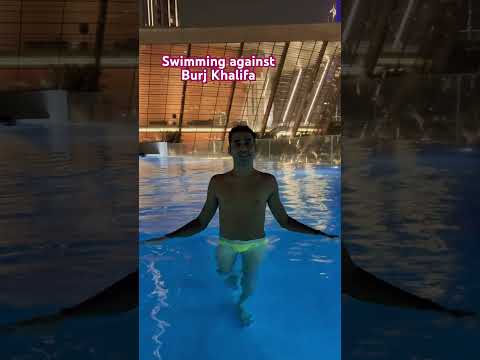 Swimming against Burj Khalifa #viral #travel #trending #vlog #dubai #shortvideo