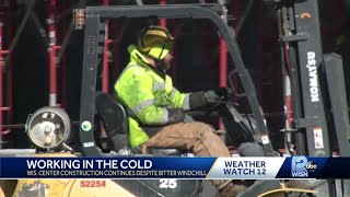 Milwaukee construction workers brave cold to get job done