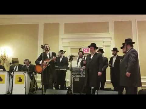 Dovy meisels sings by a chuppah with pinky Weber and mezamrim choir