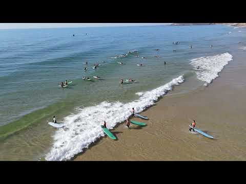 Surf learners in Salema Beach
