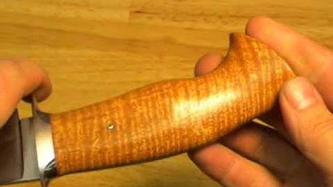 Fighting knife with curly mahogany.wmv