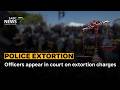 Officers appear in court on extortion charges