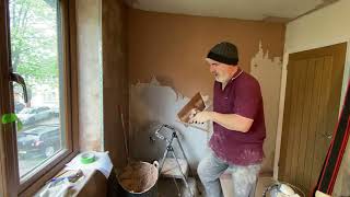 plastering a wall