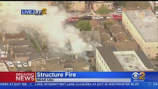A row of detached garages is burning close to homes and apartment
buildings. demarco morgan reports.
