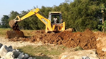 JCB Backhoe Machine Throwing Out Broken Concrete And Soul - Road Contruction - Jcb Video