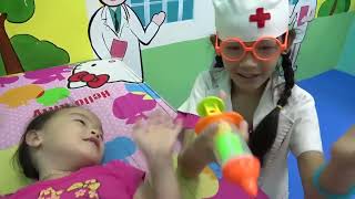 Kids doctor pretend play and healthcare for family at indoor playground - Nursery rhymes song babies