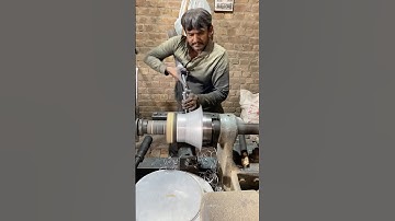 "Skilled Craftsmanship: Turning a Metal Container on a Lathe Machine"