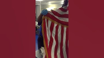 TSA Agent Calls a Passenger an Idiot; Then Wraps Himself in American Flag, Flips off the Passenger