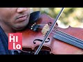 Violinist Jordan Busa plays “porch-side“ for people