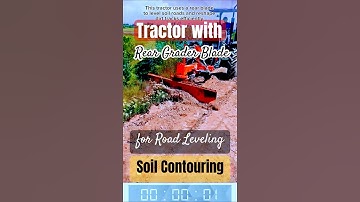 Tractor with Rear Grader Blade for Road Leveling and Soil Contouring