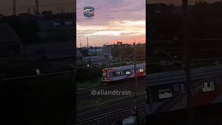 KRL CRRC melaju di sore hari memasuki Stasiun Kranji