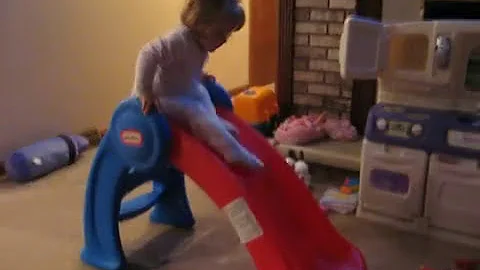 Brooke Lucille going down her slide