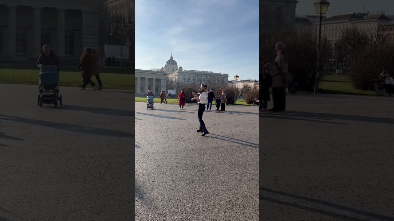 Beautiful woman playin violin on the street of Vienna 