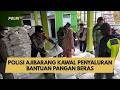 POLISI AJIBARANG KAWAL PENYALURAN BANTUAN PANGAN BERAS