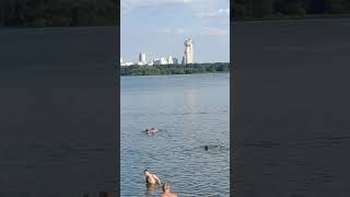 People Swim On The Beach In The Center Of Moscow, In Hot Summer Weather