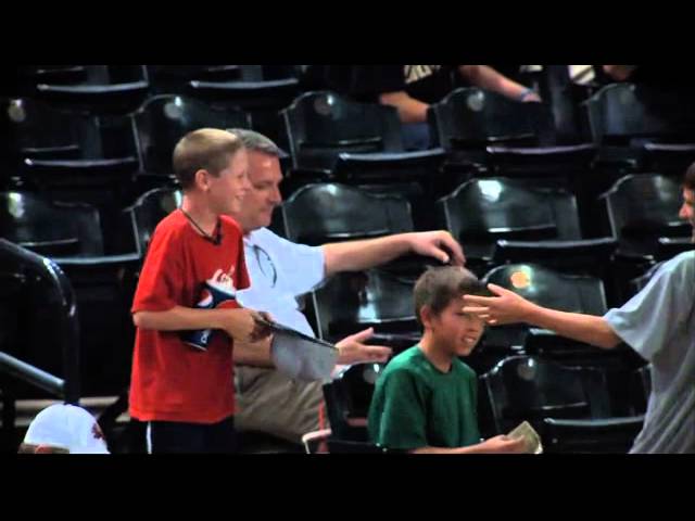 Suave little Red Sox fan gives away foul ball to the girl sitting