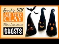 Spooky DIY luminaria air dry clay ghosts.