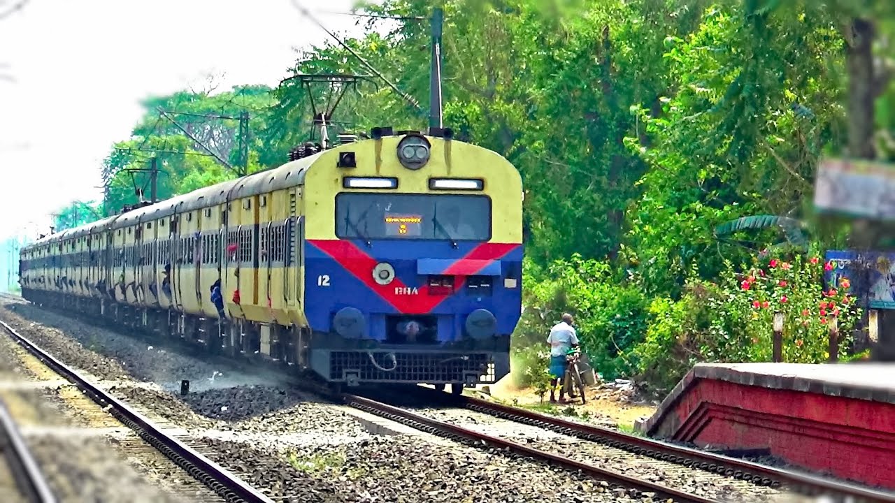 Sealdah-Lalgola modern 12 Cocahes MEMU train passing throughTaherpur
