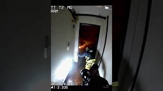 Firefighter body cam, first responders entering a burning building