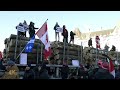 Wellington Street: Protesters cheer atop logging truck amidst freedom convoy protest 1-29-2022