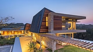 Futuristic Contemporary House Design with Curvaceous Geometric Shapes Known as Albizia House