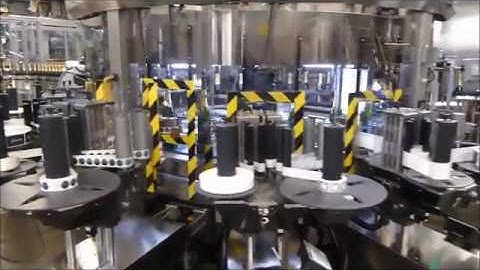 Makro Labeller applying Self Adhesive Labels to Lanson Champagne Bottles