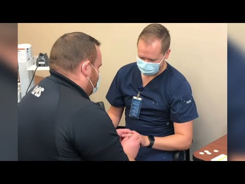 Nurse surprised by proposal during vaccination