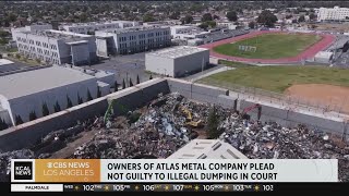 Owners of a Watts recycling plant plead not guilty in court to illegal dumping
