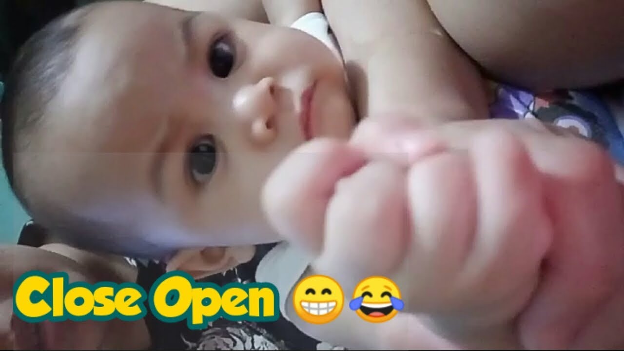 7 month old opening and closing hands