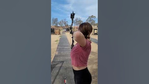 PERFECT archery shot with her compound bow and arrow