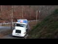 Tractor Trailer up a steep dirt road, World's best truck driver