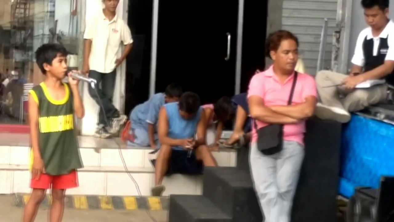 Roel Manlangit a street child singing i will always love you by whitney houston HD