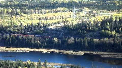 NIPIGON C.P.R.TRAIN CRUISING DOWN PAST IVAN LAKE