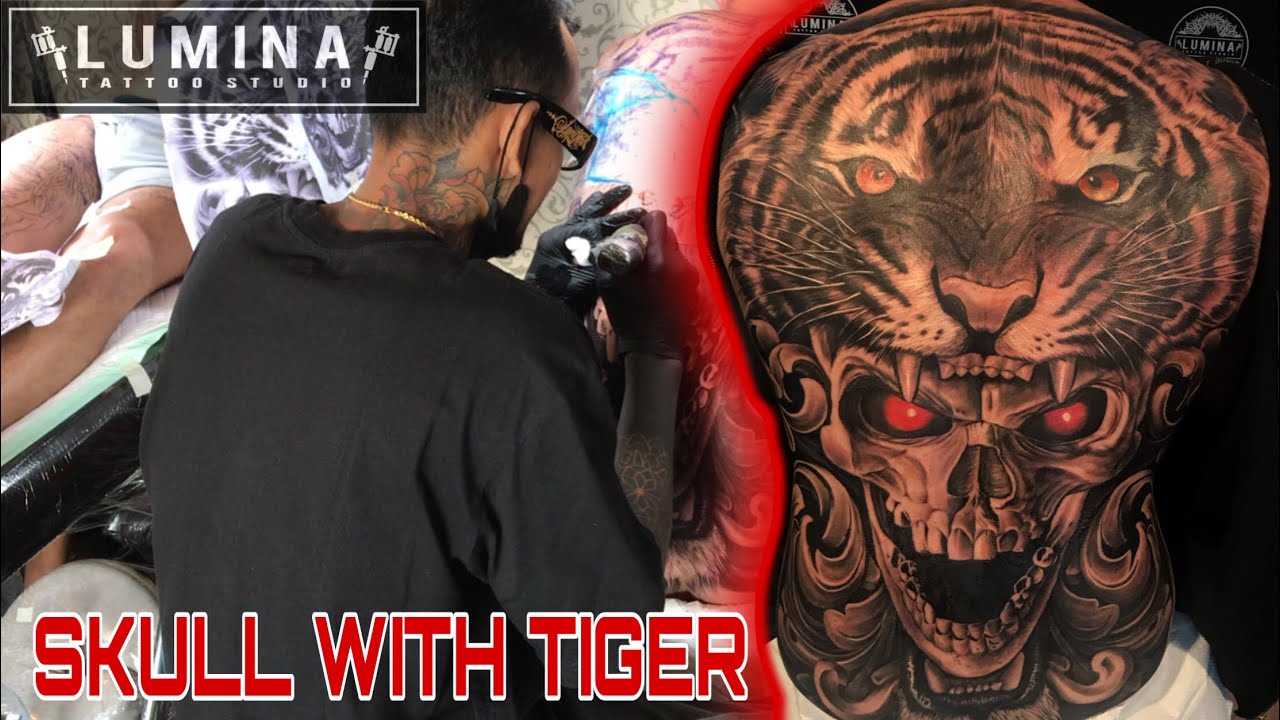 Shawn Wilken | Tiger skull watch flower tattoo